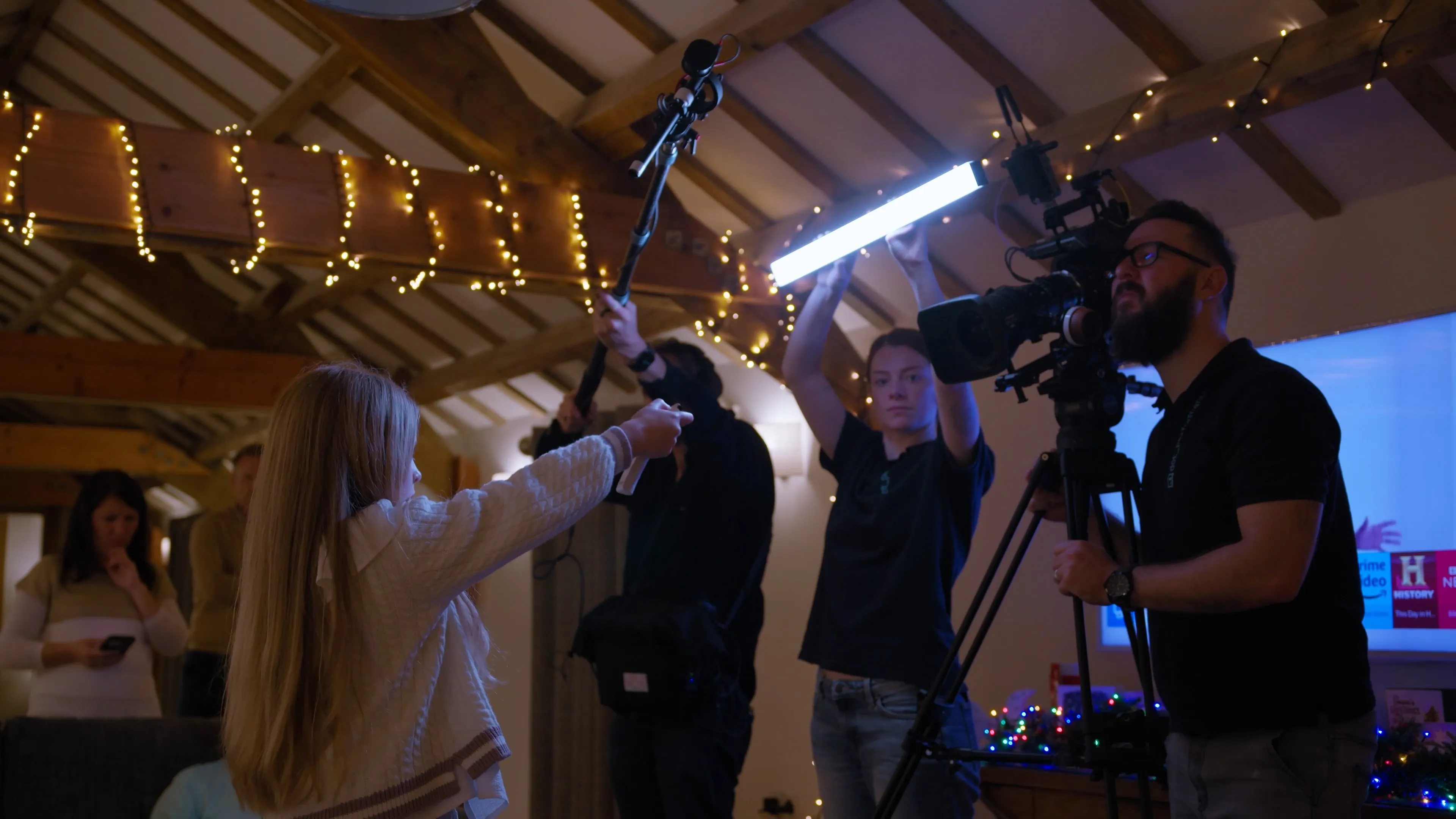Dave Armstrong, Ella Garvey, Nico van Loggerenberg and Vivi filming inside a decorated venue on the Isle of Man,  during a brand film production